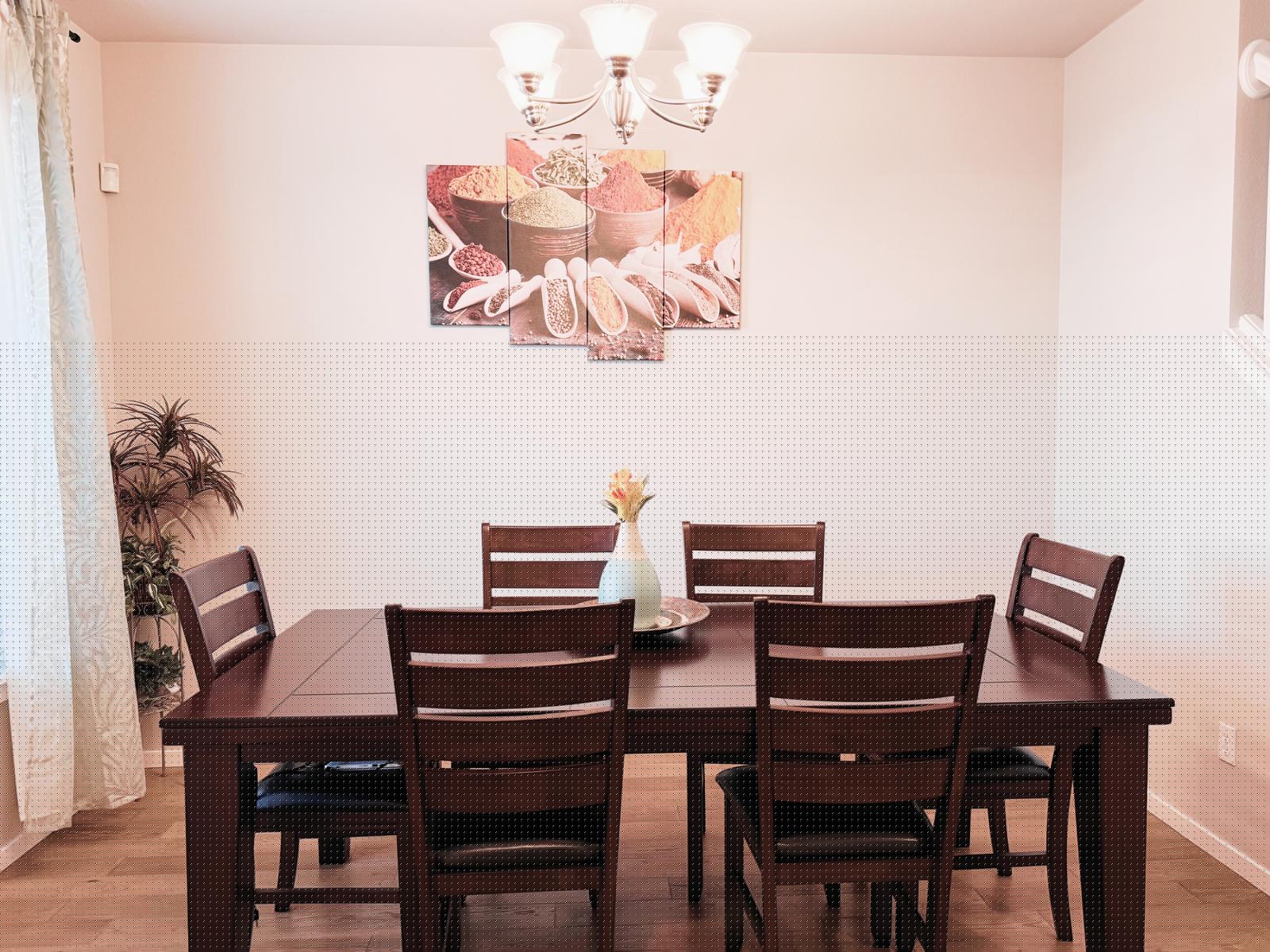 Dining room with a wood table and chandelier