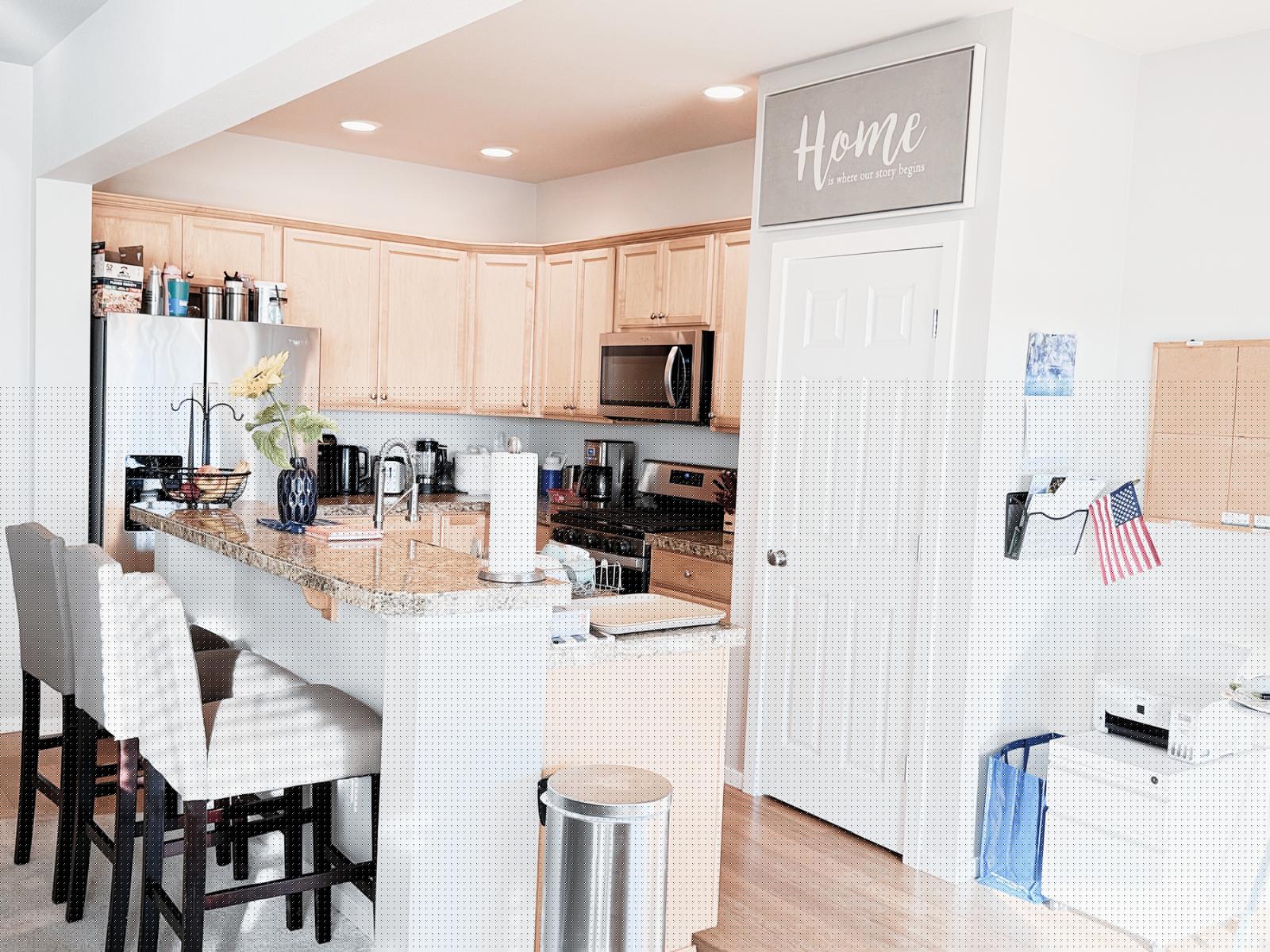 Kitchen with breakfast bar and stainless appliances